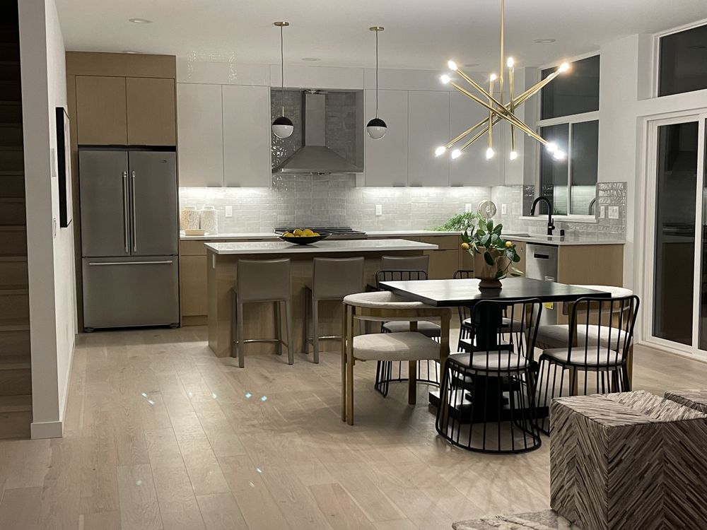 Completed modern kitchen with custom cabinetry and tile work