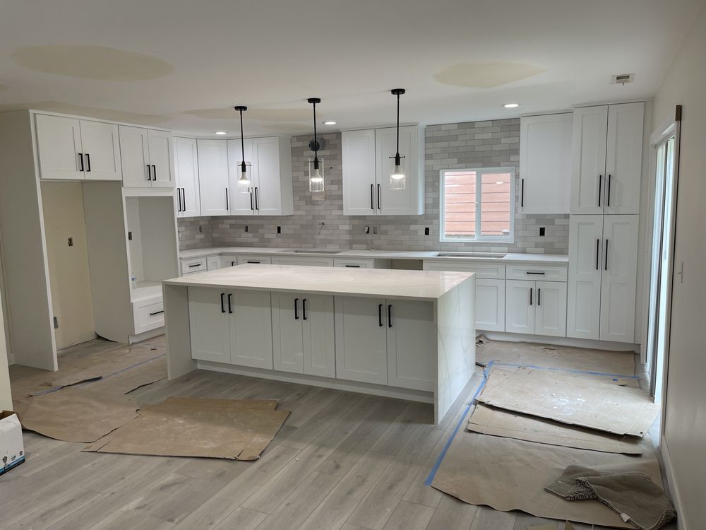 Modern white kitchen remodel with custom cabinets and subway tile